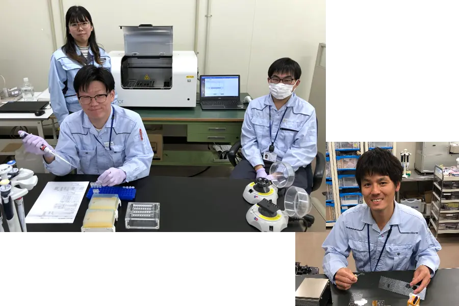 ワイシャツを着用し、研究に取り組んでいる姿。